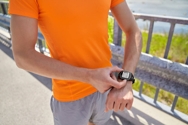 close up of man with fitness tracker outdoors - Photo, Image