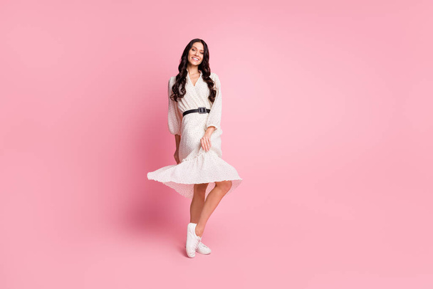 Full length body size photo of female student wearing dotted summer dress dancing isolated on pastel pink color background with blank space - Φωτογραφία, εικόνα