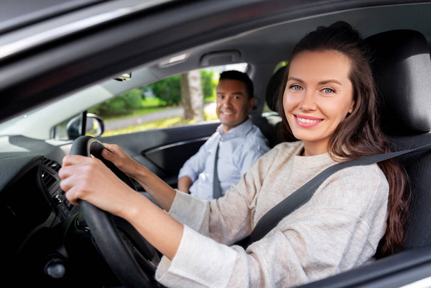 car driving school instructor teaching woman - Foto, Imagen
