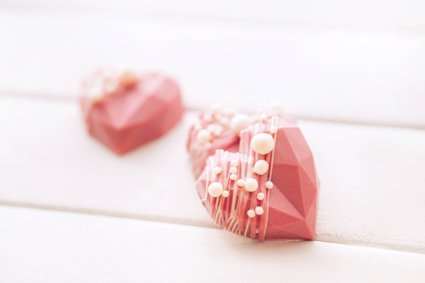Pink heart-shaped cake. Gift for Valentine's Day and Women's Day. - Photo, Image