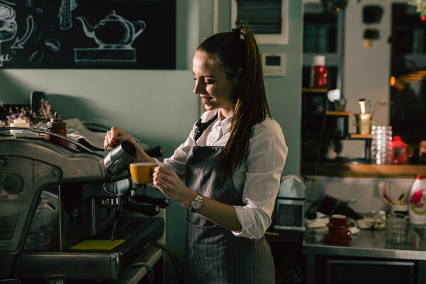 waitress preparing coffee in cafeteria - Photo, Image