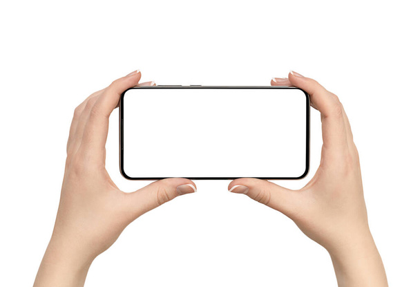mani femminili che tengono smart phone su sfondo bianco isolato - Foto, immagini