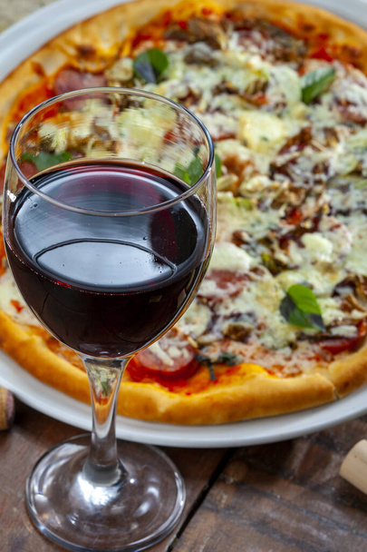 Dinner with wine and pizza - Foto, imagen