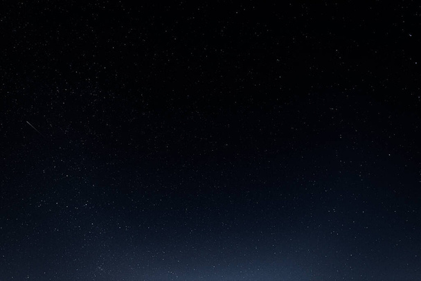 A starry sky with many stars and a flying meteor - Valokuva, kuva