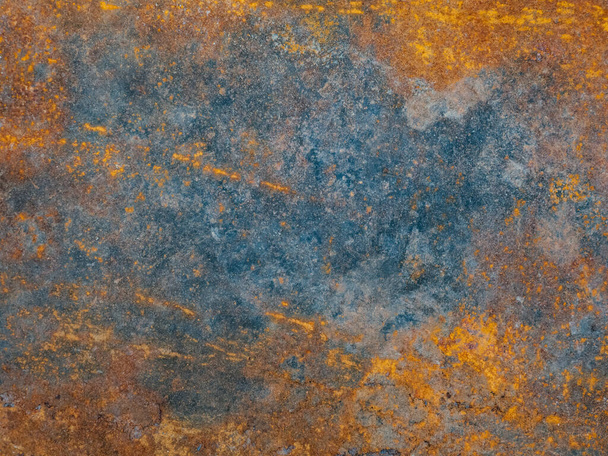 Corrosion. Metal plate with weathered colors and rust. Natural light. Blue and orange metal plate. Old oxidized colorful textured surface. Abstract grunge rusty metallic background for multiple uses. - Photo, Image