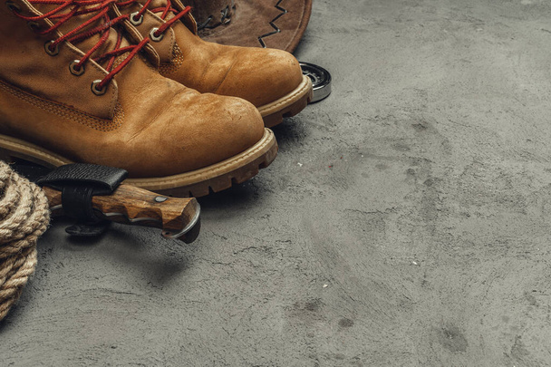 Hiking boots with travel accessories on grunge background - Valokuva, kuva