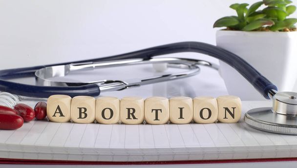 ABORTION word with building blocks, medical concept background. - Foto, immagini