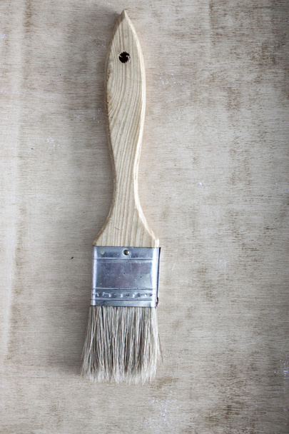 paint brush on a wooden background - Foto, afbeelding