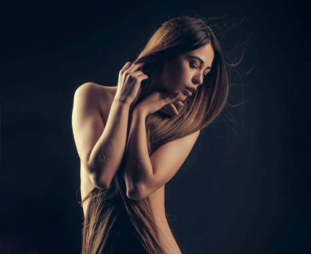 Woman with long hair and naked chest. Hairdresser concept. Woman with very long hair. Beauty hair salon. Haircare and shampoo. Portrait of beauty with beautiful healthy long hair - Фото, зображення
