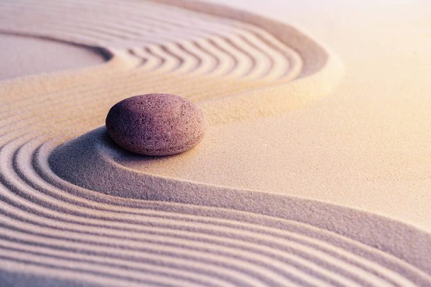 Meditation zen garden with stones on sand - Foto, afbeelding