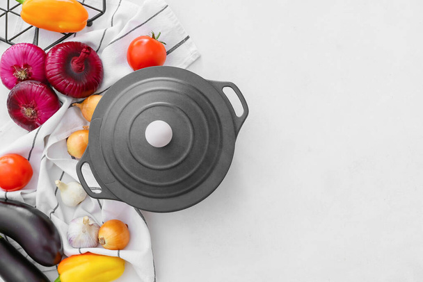 Vegetables and cooking pot on light background - Valokuva, kuva