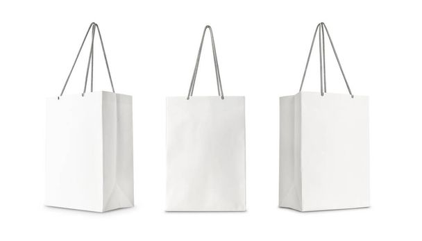 Σύνολο Λευκό χαρτί shopping bag μπροστινή όψη και πλευρική προβολή που απομονώνονται σε λευκό φόντο με clipping διαδρομή. - Φωτογραφία, εικόνα
