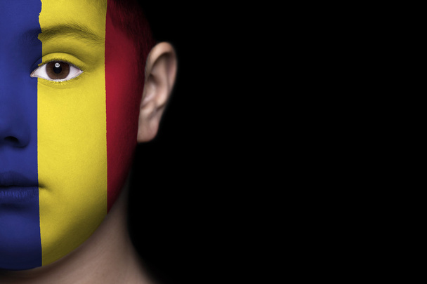 Human face painted with flag of Romania - Fotografie, Obrázek