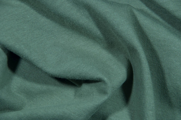Tone, texture. Cotton fabric with a small pattern in gray color with pleats. - Fotografie, Obrázek