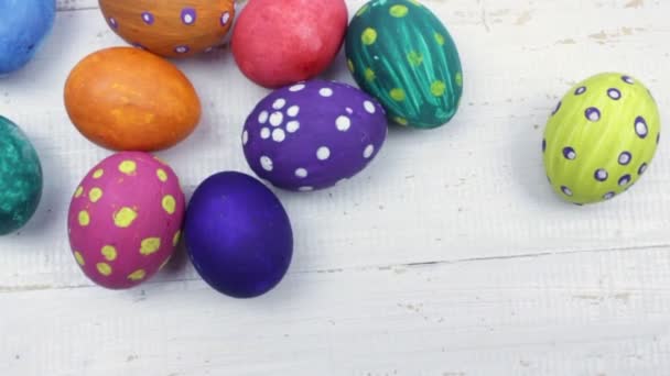 Easter. Multicolored Easter eggs and pink tulips - Footage, Video