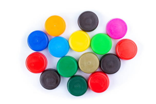 Group of multi colored bottle caps on a white background. Recycling and reuse concept. Space for text. Top View. - Foto, immagini