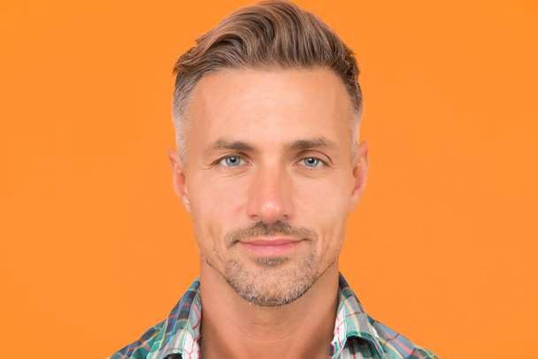 Male natural beauty. sexy man yellow background. portrait of real man. mature man unshaven face. smiling guy pleasant face. male skin and facial care. confident fashion model. barber salon services - Foto, afbeelding