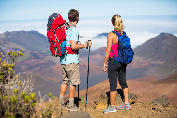 Hikers enjoying the view from the mountain top - Photo, Image