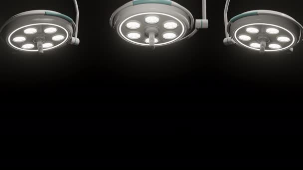 világító és forgó sebészeti lámpák fekete alapon - Felvétel, videó