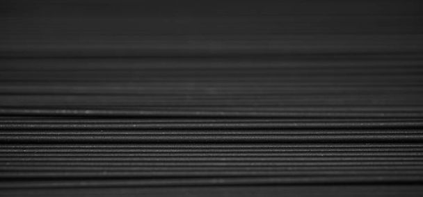 Μαύρο φόντο σπαγγέτι. Μελάνι καλαμαριού μακαρόνια "romagnola" στυλ. Για σχεδιαστικούς σκοπούς - Φωτογραφία, εικόνα