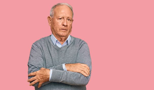Senior caucasian man wearing casual clothes skeptic and nervous, disapproving expression on face with crossed arms. negative person.  - Photo, Image