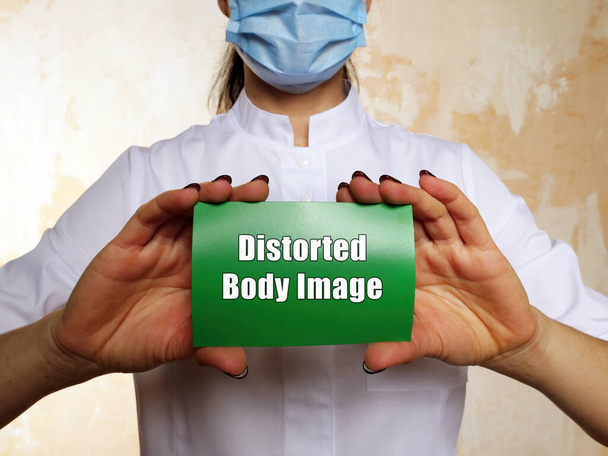 Lääketieteellinen käsite, joka tarkoittaa vääristynyttä kehonkuvaa, johon on kaiverrettu paperi - Valokuva, kuva