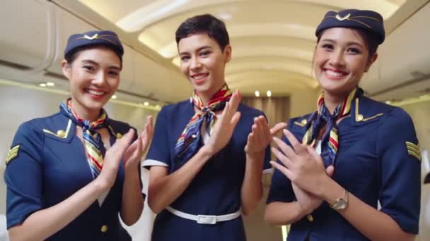 Cabin crew clapping hands in airplane - Footage, Video