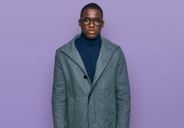 Young african american man wearing business clothes and glasses looking sleepy and tired, exhausted for fatigue and hangover, lazy eyes in the morning.  - Photo, Image