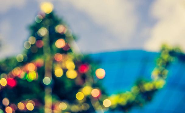 blur image of Green Christmas Tree for background usage . (vintage tone) - Foto, imagen