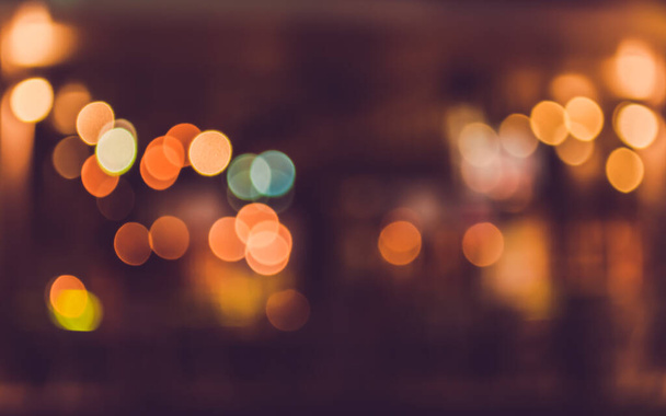 image of blurred bokeh background with warm colorful lights. (vintage tone) - Photo, Image