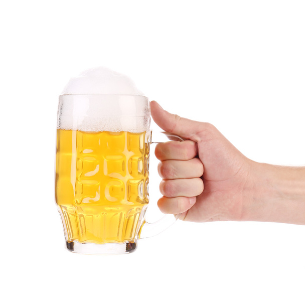 Hand with a beer glass. - Zdjęcie, obraz