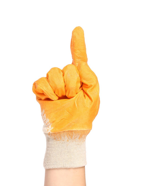 Hand in rubber glove shows one. - Foto, afbeelding