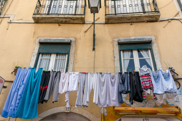 underwear drying on the wall of the house - Фото, изображение