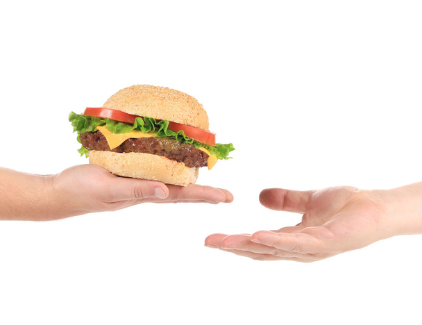 Hand holding hamburger. - Foto, imagen