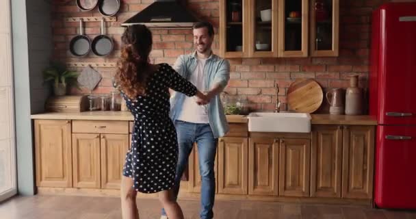 Couple dancing holding hands swirling feel happy enjoy weekend - Záběry, video