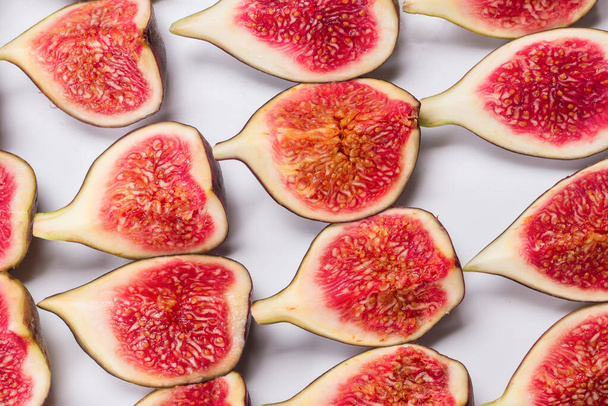 Tasty figs background. Top view. Slices.   - Foto, afbeelding