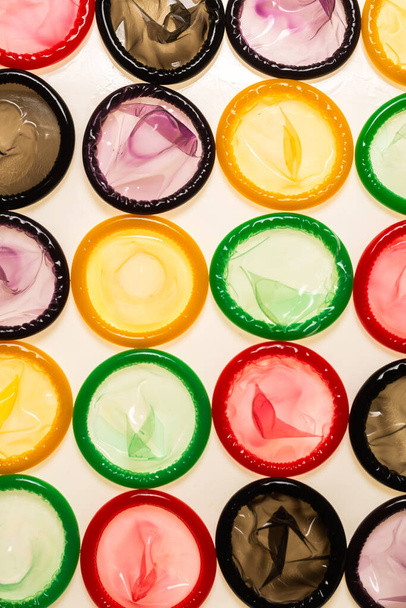 Colorful condoms background. Top view.  - Фото, зображення