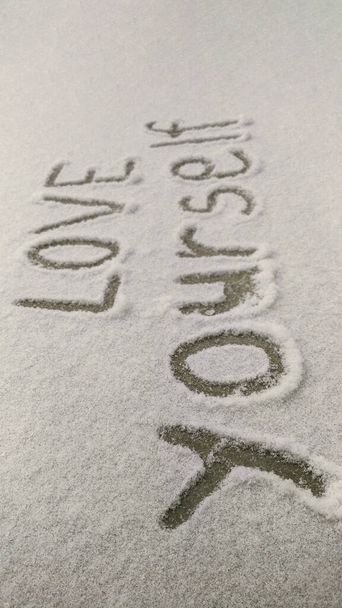 The inscription on the snow LOVE YOURSELF close up - Photo, Image