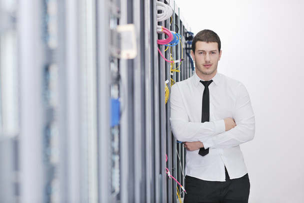 Young handsome business man it engineer in datacenter server room - Фото, зображення