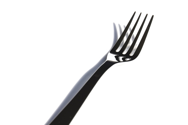  A white plate with silver fork - Photo, Image
