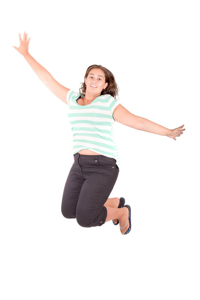 teenage girl jumping isolated in white - Foto, imagen