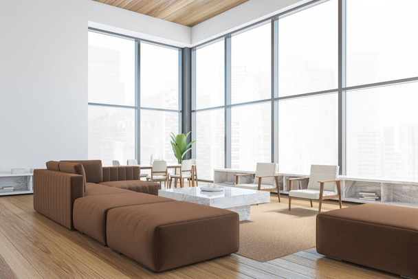 Modern office waiting area with brown armchairs and sofa, a marble coffee table, wooden parquet. Panoramic city view windows. Hotel relax area. 3d rendering mock up. - Fotografie, Obrázek