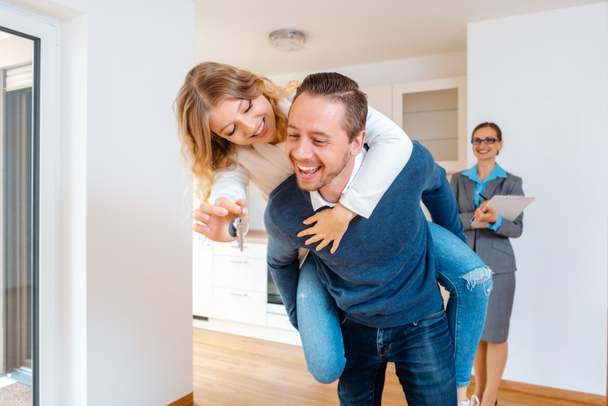 Woman and man being extremely happy about their new home - Photo, Image