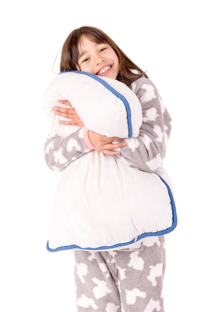 little girl on her pajamas in bed isolated in white - Valokuva, kuva