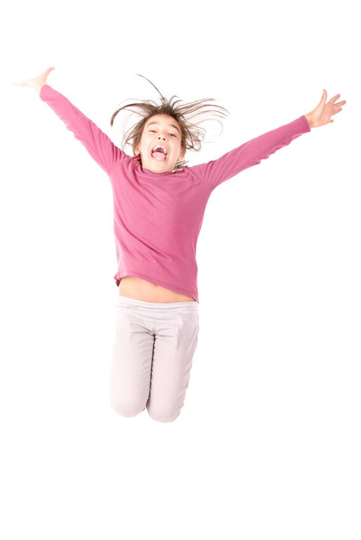 Маленька дівчинка стрибає ізольовано на білому тлі
 - Фото, зображення
