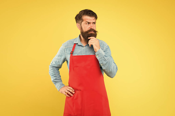 Small business shop owner. mature shop assistant. professional chef in apron. restaurant staff wanted. cooking is his hobby. bearded man in cook uniform. confident male housekeeper. Cooking by recipe - Zdjęcie, obraz