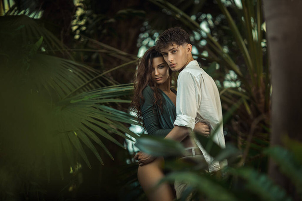Romantic Couple in Love Standing in the Tropical Jungle - Фото, изображение