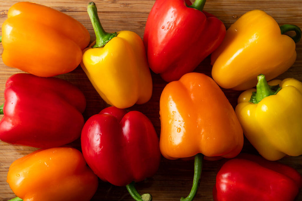 Orange, red and yellow bell peppers - Photo, Image