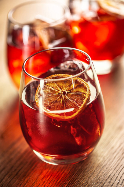 Negroni classic cocktail and gin short drink with sweet vermouth, red bitter liqueur and dried orange garnish. - Photo, Image