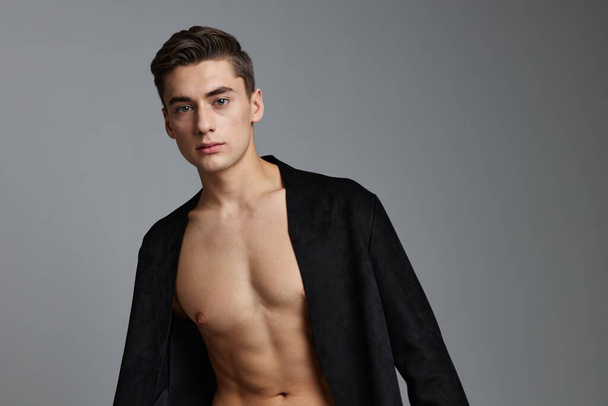 man in black jacket naked torso attractive look posing self-confidence - Photo, Image